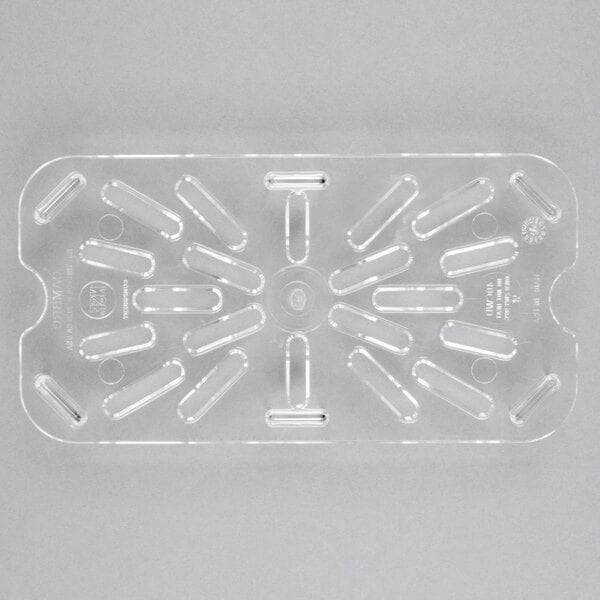 A clear plastic Cambro drain tray with holes in it.