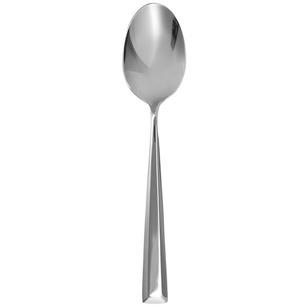 A close-up of a Walco stainless steel serving spoon with a long handle.