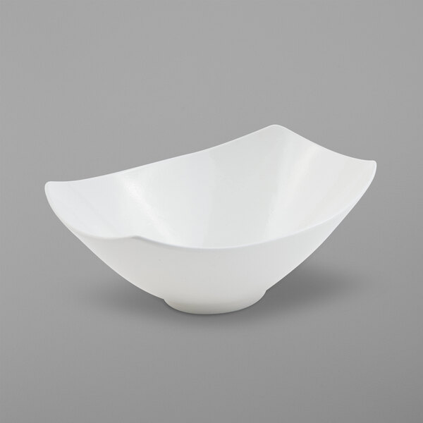 A white Bon Chef Gondola bowl with a curved edge.