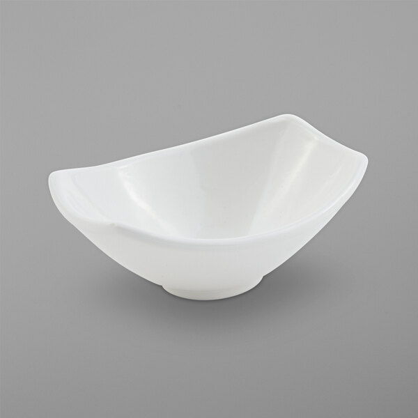 A close up of a white Bon Chef Gondola bowl with a curved edge.