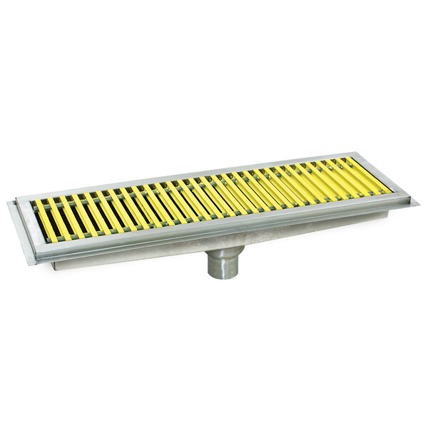 A metal floor trough grate with yellow and black stripes.