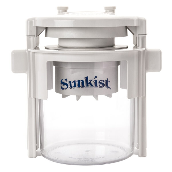 A white plastic container with a white lid holding a Sunkist tomato slicer attachment.