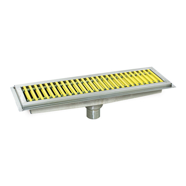 A stainless steel floor trough with yellow fiberglass grating.
