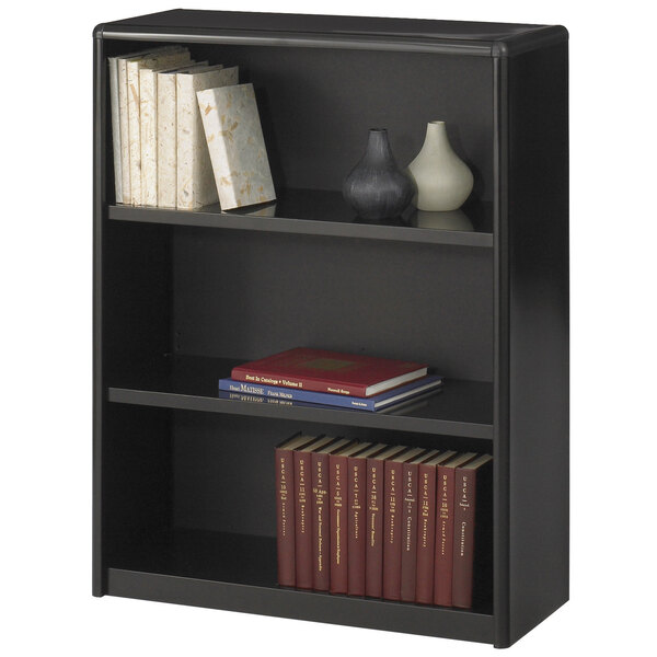A black Safco bookcase with books and vases.