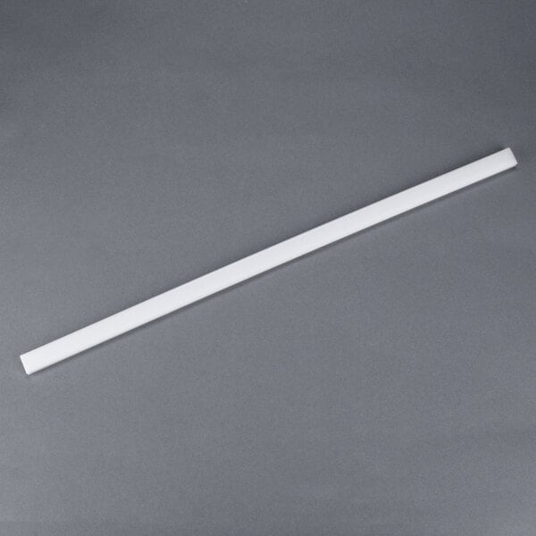 A white plastic strip on a gray background.