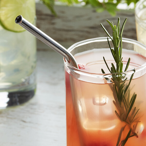 A Barfly stainless steel bent straw in a glass of lemonade with a rosemary sprig.