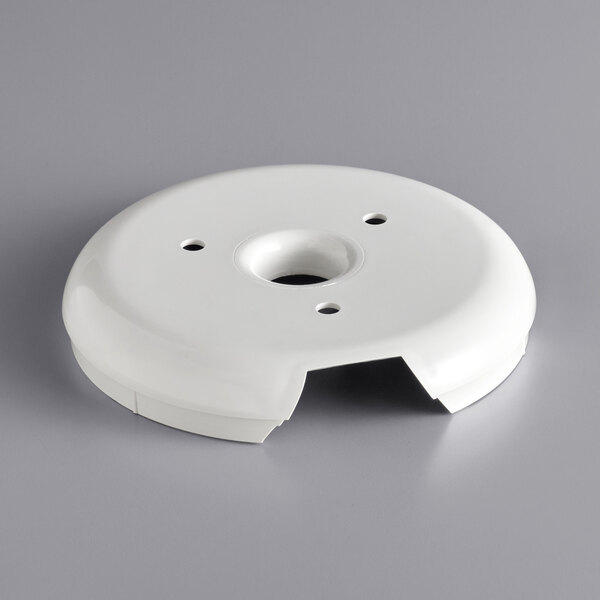 A white plastic bowl support with holes.