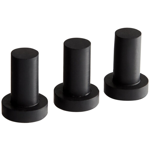 A group of black cylindrical rubber feet.