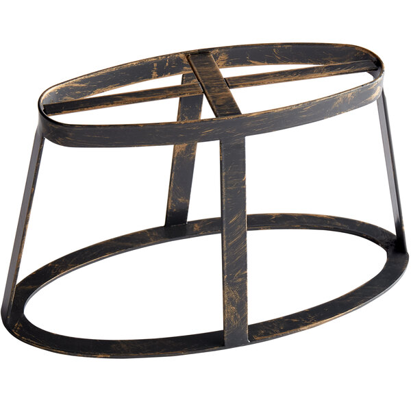 An antique brass oval stand with a circular design.