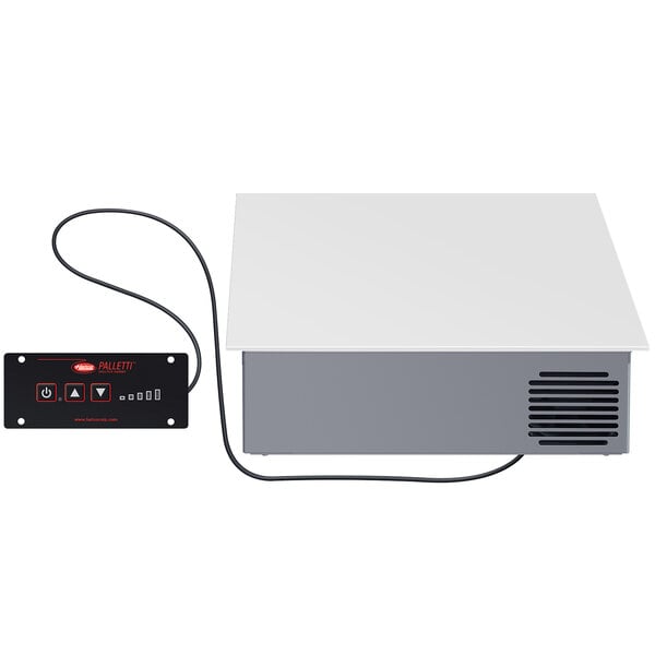 A white rectangular Hatco drop-in induction warmer with a black cord and vent.