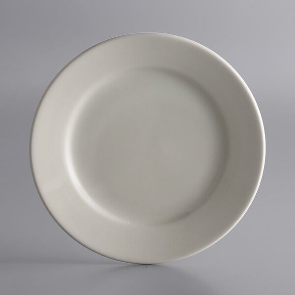 A Libbey Princess White stoneware plate with a white rim on a white background.