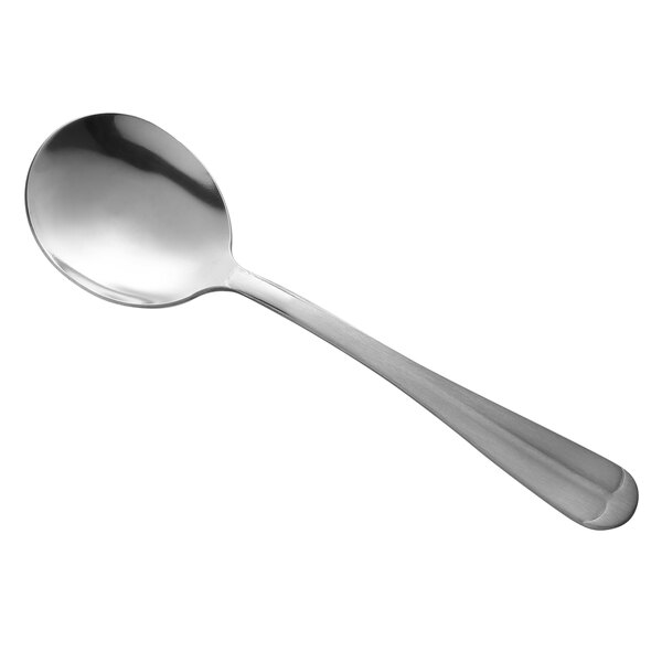 A Libbey bouillon spoon with a silver handle.