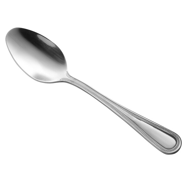 A Libbey stainless steel dessert spoon with a silver handle and bowl.