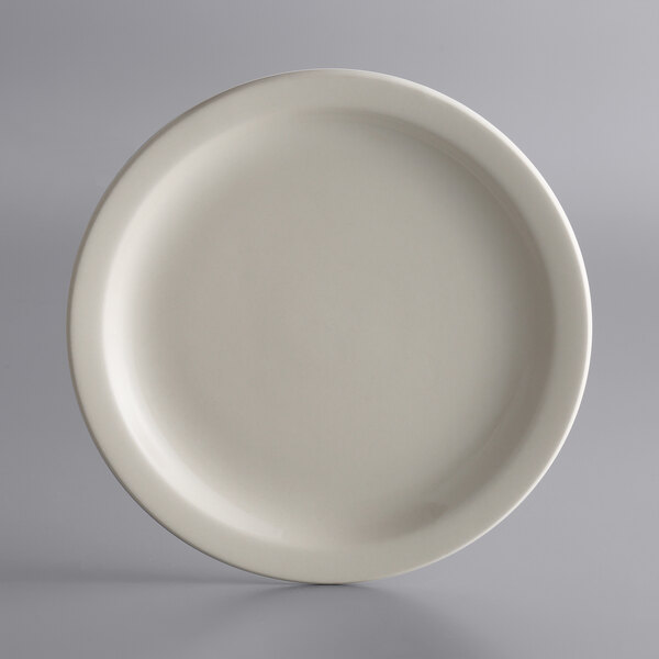 A white Libbey stoneware plate with a narrow rim.