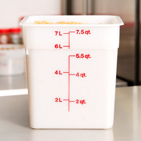 A white rectangular Cambro food storage container with red text.