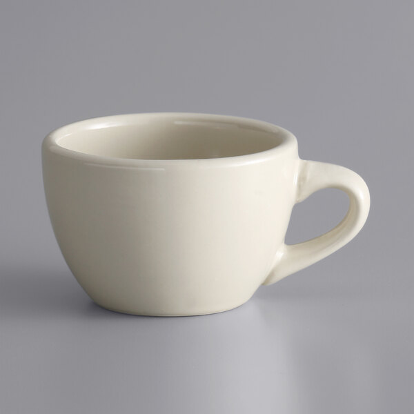 A white Libbey narrow rim stoneware cup with a handle.