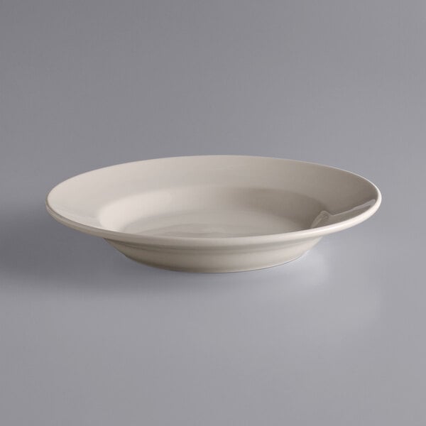 A close up of a white Libbey stoneware pasta bowl with a rolled edge.