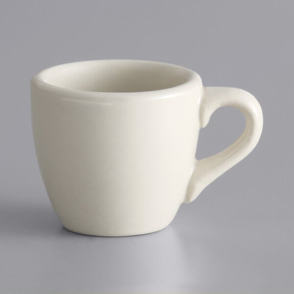 A white Libbey stoneware demitasse cup with a handle.