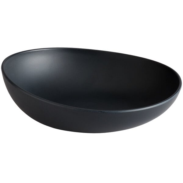 A dark gray irregular round melamine serving bowl.