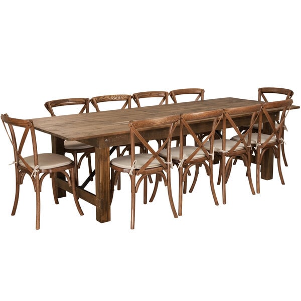 A Flash Furniture rustic wooden dining table with white cushioned chairs.