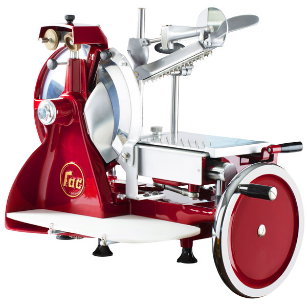 A red and silver Omcan manual meat slicer with a metal blade.