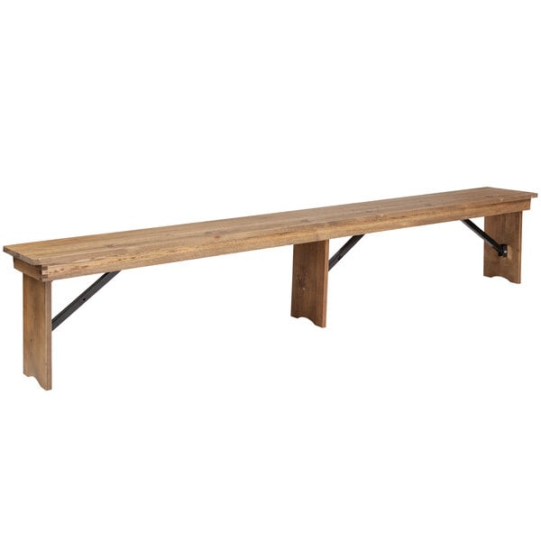 A long wooden bench with metal legs.