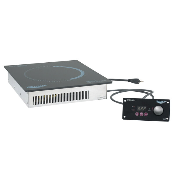 A black Vollrath Mirage Series drop-in induction warmer on a countertop.