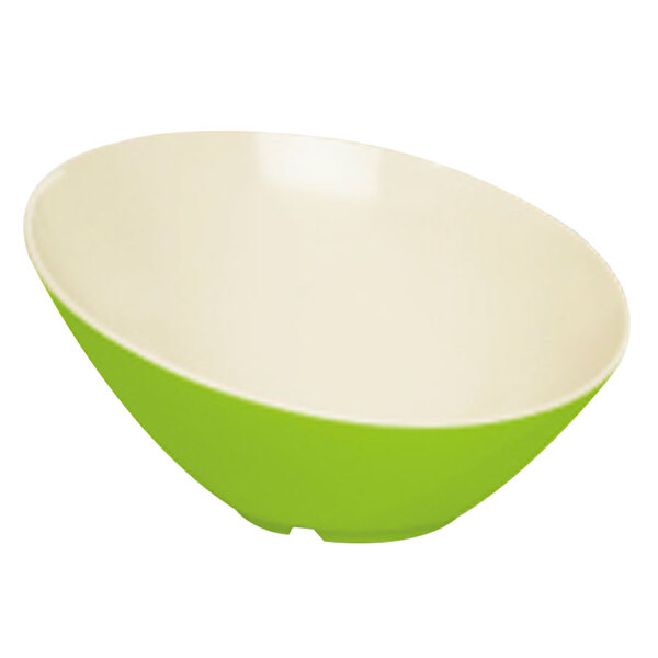 A green slanted melamine bowl with a white rim.