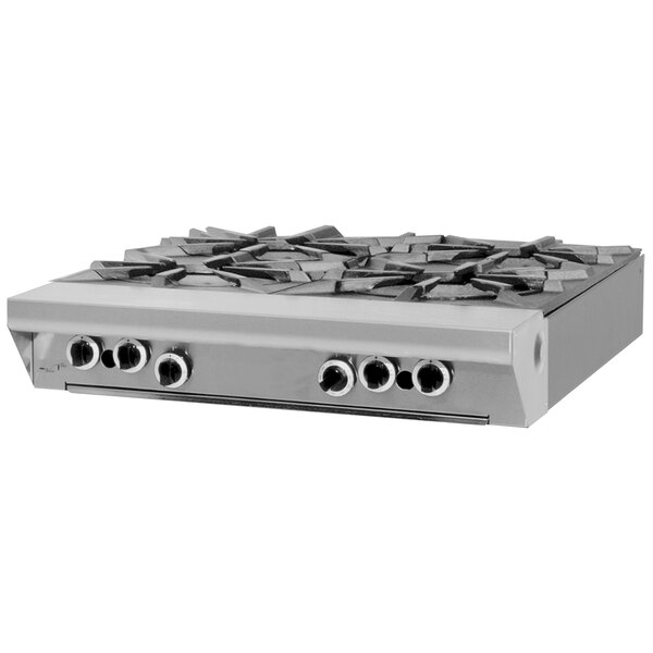 A Garland stainless steel natural gas range with four burners.