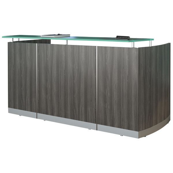 A Safco Medina reception desk with a glass top and wood base.