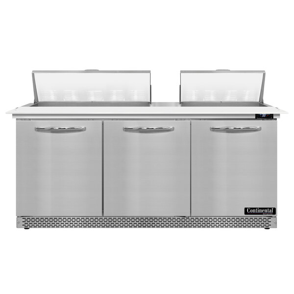 A stainless steel Continental Refrigerator with three doors and a cutting top.