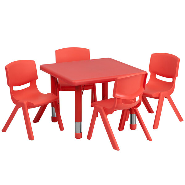 A red plastic table and chairs set with a red table and chairs.