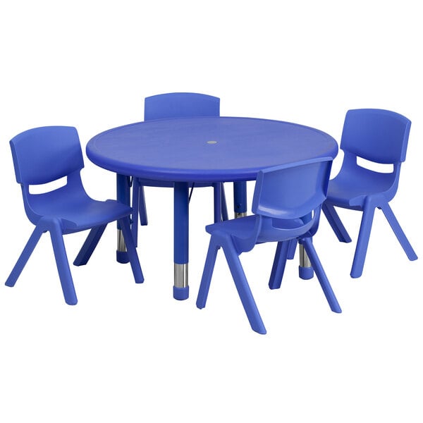 A blue plastic table with four blue chairs.