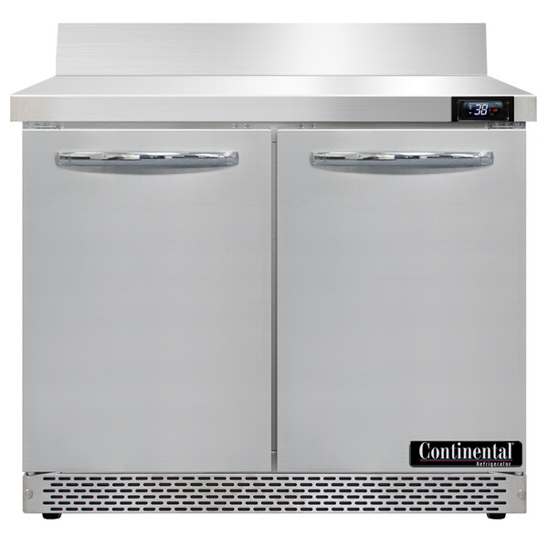 A Continental Refrigerator worktop refrigerator with two doors on a metal surface.