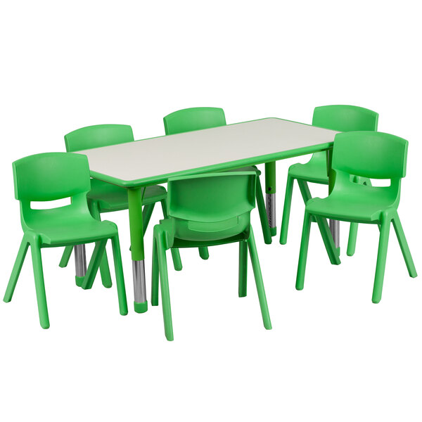 A green plastic rectangular table with green plastic chairs.