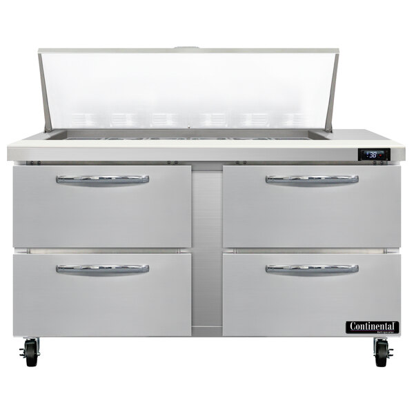 The stainless steel drawers of a Continental Refrigerator 4 drawer sandwich prep table.