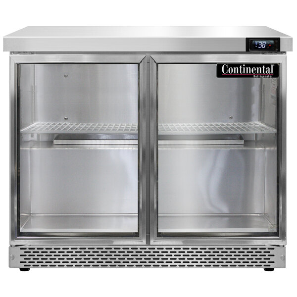 A Continental Refrigerator undercounter refrigerator with glass doors on a white counter.