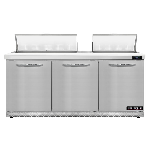 A Continental Refrigerator front breathing refrigerated sandwich prep table with three doors on a counter.