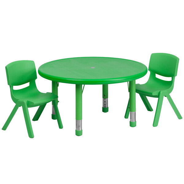 A green plastic table and two green chairs.