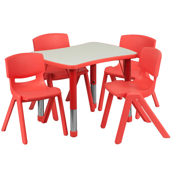 A red plastic Flash Furniture rectangular table and chairs.