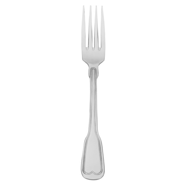 A silver Walco Camelot dinner fork with a black background.
