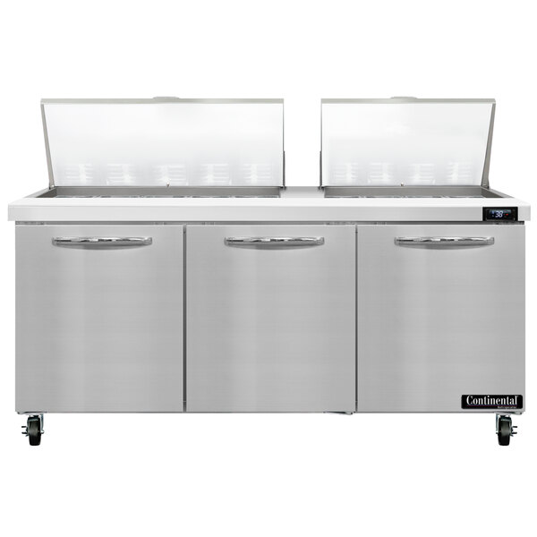 A Continental Refrigerator Mighty Top refrigerated sandwich prep table with two doors open.