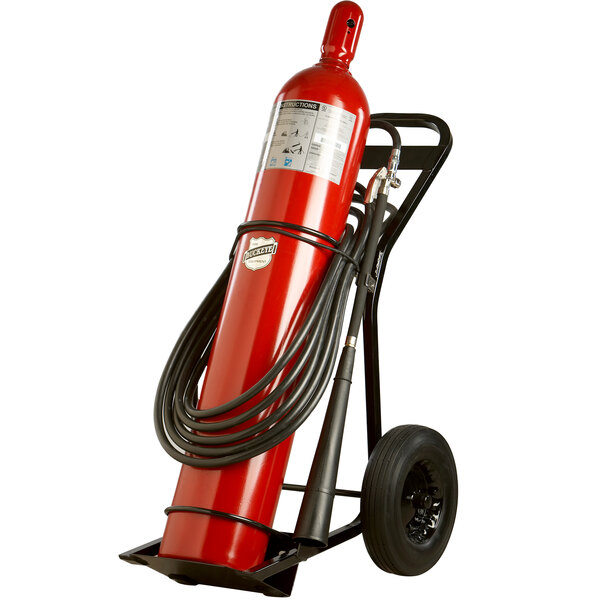 A Buckeye carbon dioxide fire extinguisher on a hand truck.