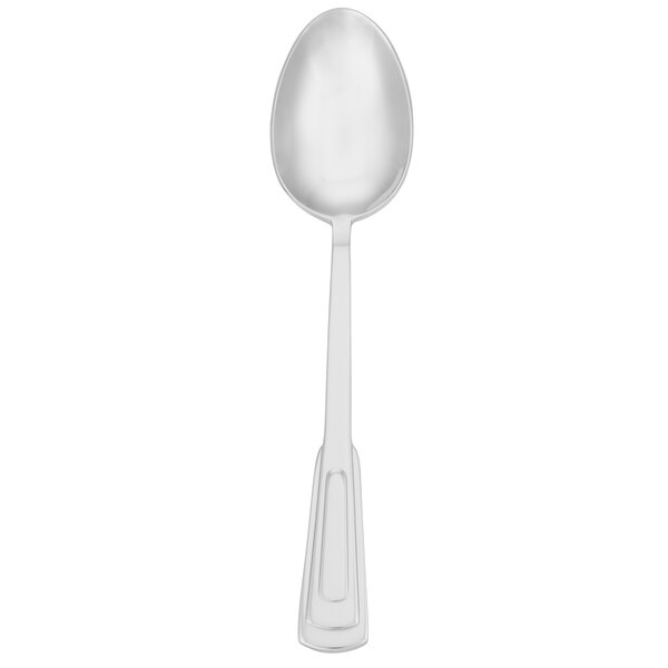 A silver Walco 18/10 stainless steel serving spoon with a white handle.