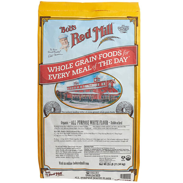 A bag of Bob's Red Mill Organic Unbleached All-Purpose Flour on a white background.