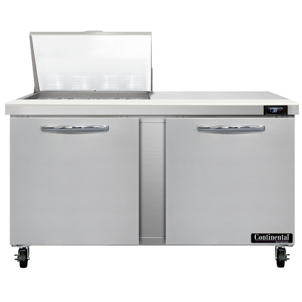 A stainless steel Continental Refrigerator with two open doors.