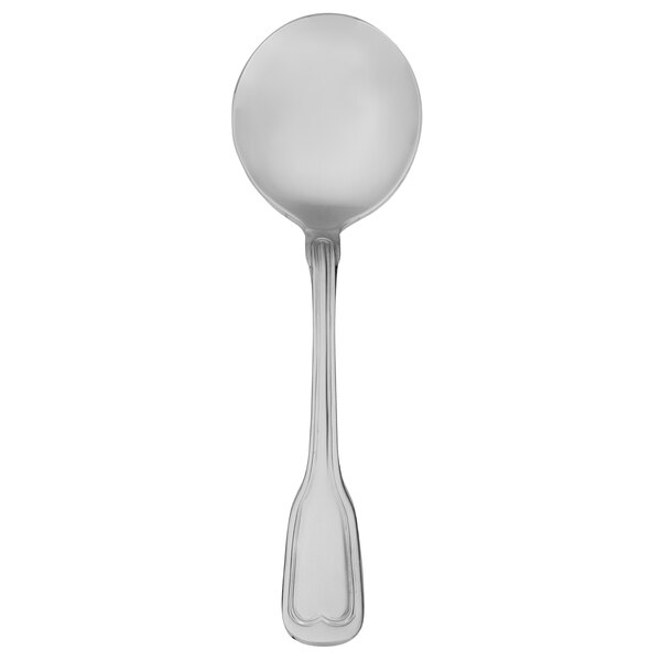 A silver Walco Camelot bouillon spoon with a white background.