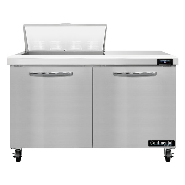 A stainless steel Continental Refrigerator with two doors and a lid.