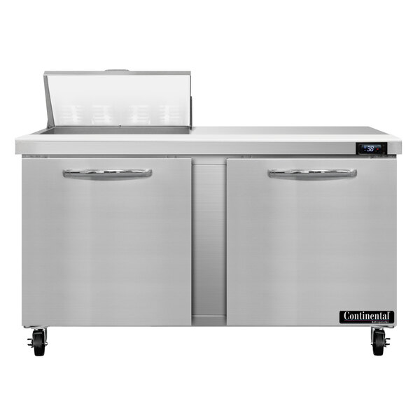 A Continental Refrigerator stainless steel 2 door refrigerated sandwich prep table on a white counter.