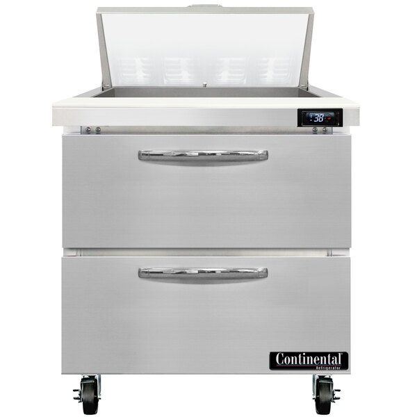 A stainless steel Continental Refrigerator with 2 large drawers open.